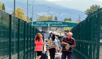 About 40,000 people and more than 7,000 vehicles cross the border through Adler checkpoint every day